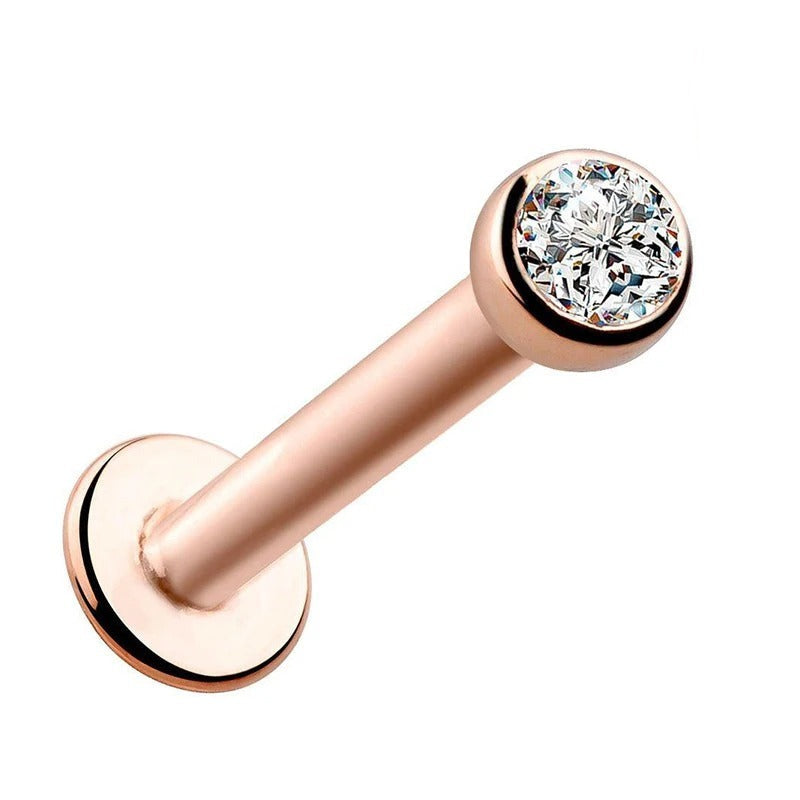 Accessoire d'oreille piercing labret en or rose avec strass.