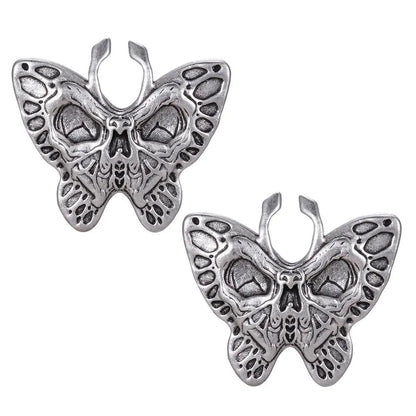 Plugs d'oreilles au design papillon en argent.